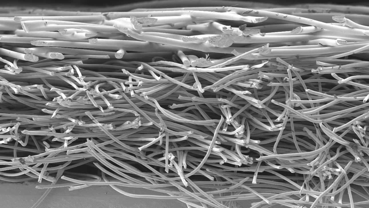 1290x726 Filtura technologies microscopic cross section of filter media with support layer mobile header copyrights Freudenberg Performance Materials BV.png